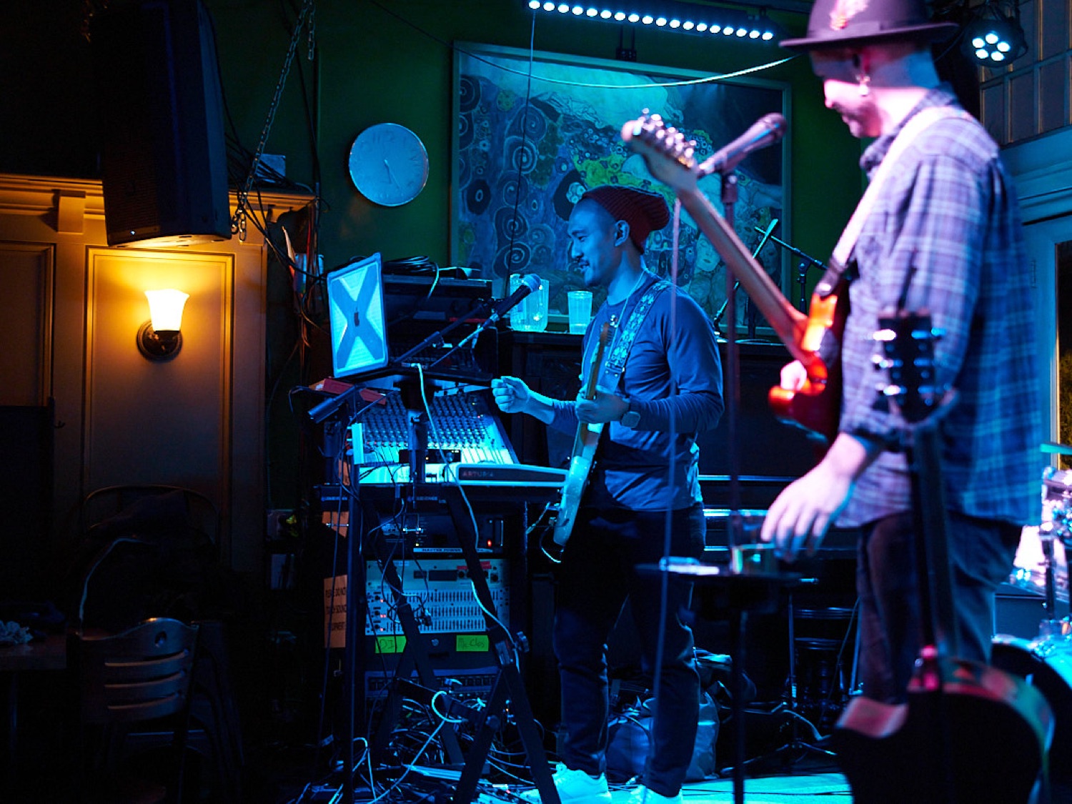 Mike and Jordan under blue stage light